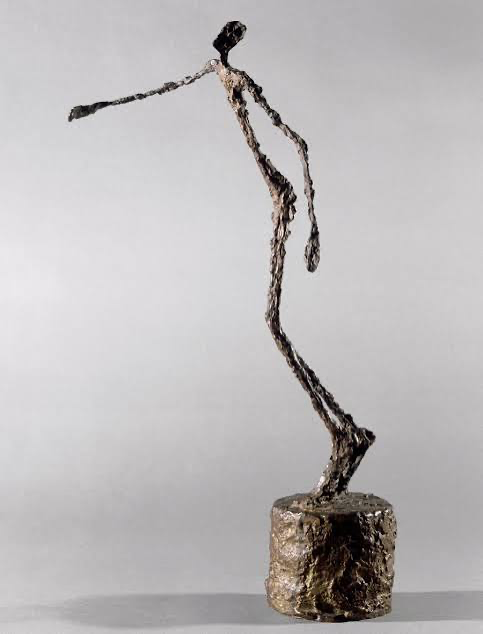 Alberto Giacometti — a thin bronze figure leaning forward from a heavy base.