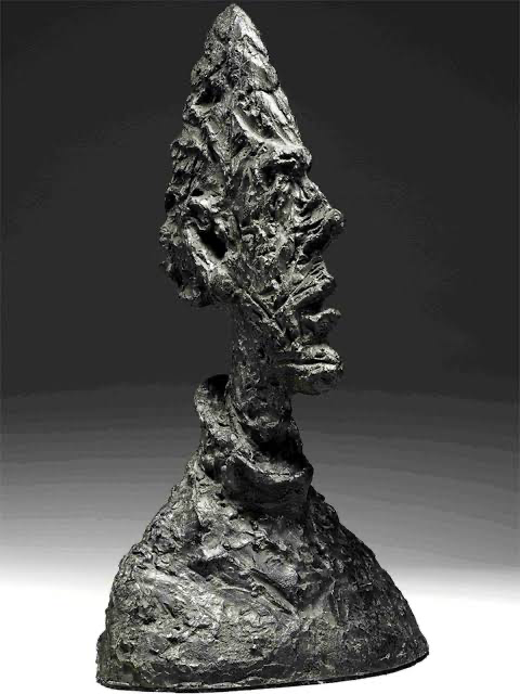 Alberto Giacometti — a bronze bust with a narrow, knife-edged head.