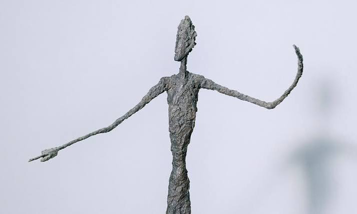 Alberto Giacometti — a thin bronze figure with arms outstretched.
