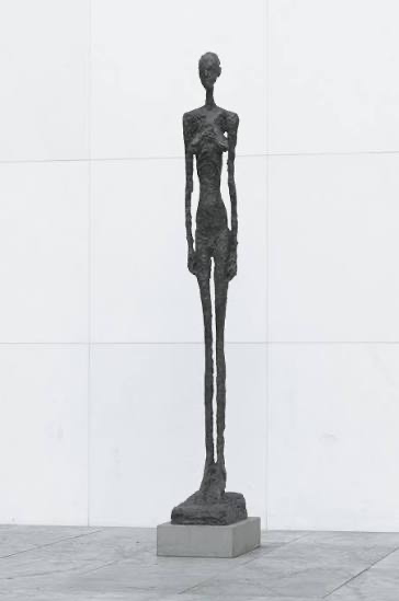 Alberto Giacometti — a single tall, emaciated bronze figure standing on a plinth.